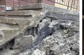 Crumbling, spalled concrete front steps before repair in the GTA
