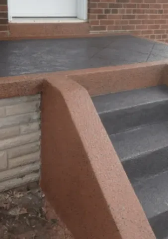 Restored porch steps with fresh parging on the retaining wall